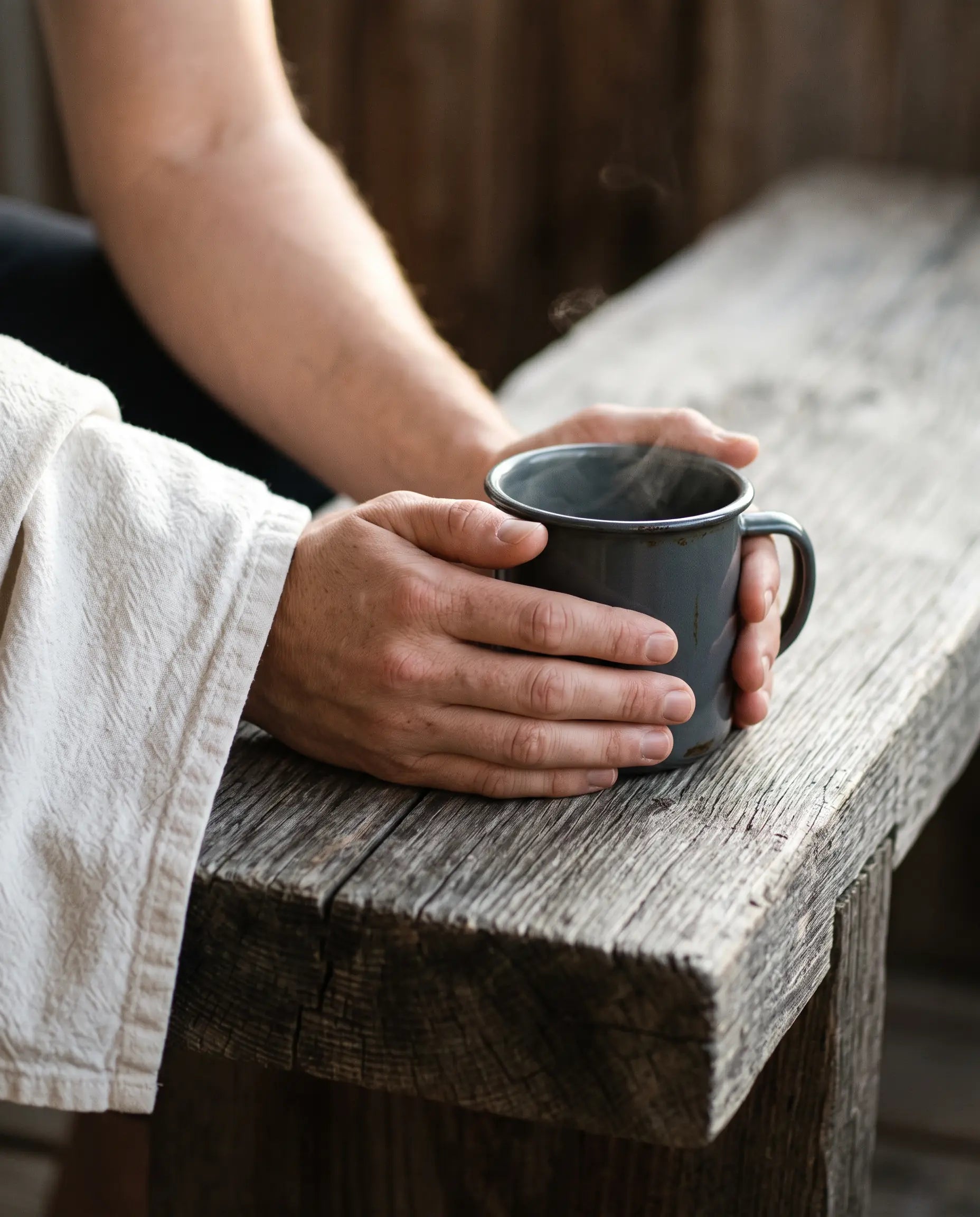 Two hands holding a warm mug after a session